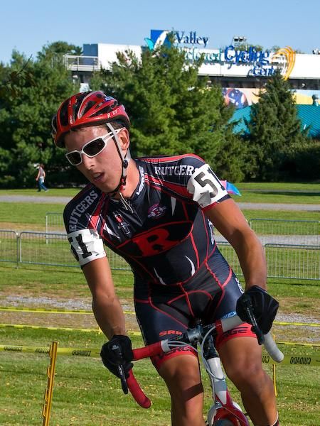Patrick Bradley (Rutgers) navigates the course with the Valley Preferred Velodrome visible in the background.