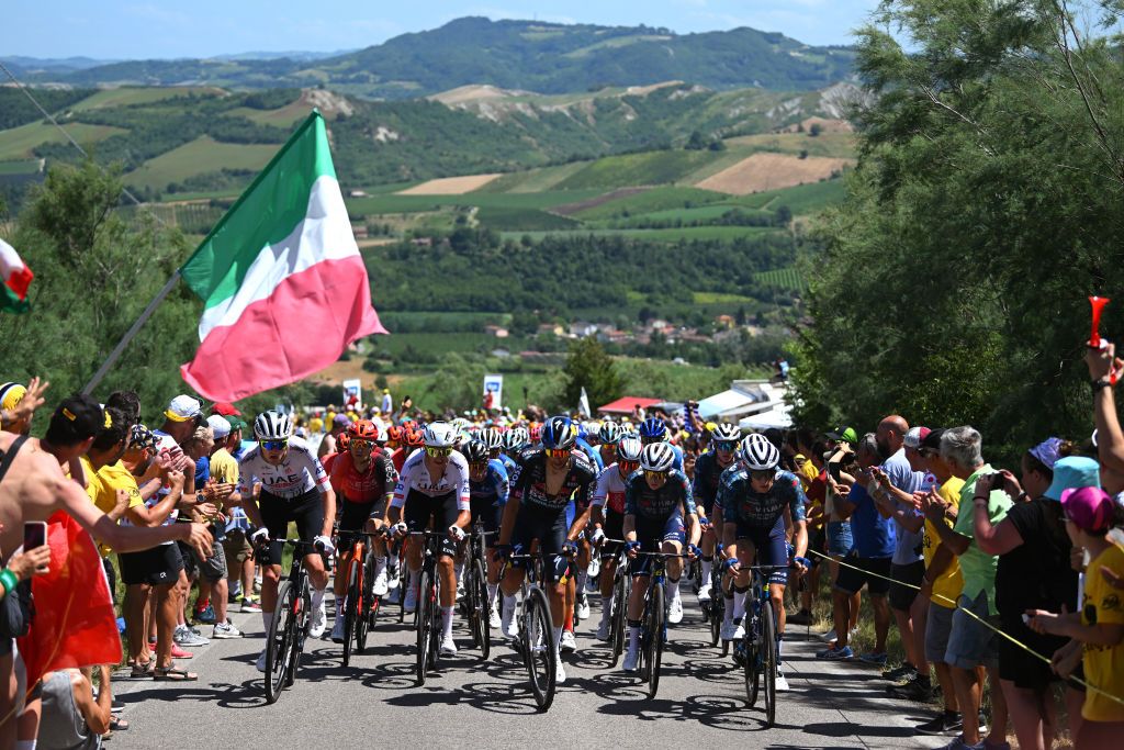 BOLOGNA ITALY JUNE 30 A general view of Pavel Sivakov of France and UAE Team Emirates Michal Kwiatkowski of Poland and Team INEOS Grenadiers Fabien Grellier of France and Team TotalEnergies Matteo Sobrero of Italy and Team Red Bull BORA hansgrohe Jonas Vingegaard Hansen of Denmark Jan Tratnik of Slovenia and Team Visma Lease a Bike and the peloton compete climbing to the Cote de Gallisterna 255m while fans cheers during the 111th Tour de France 2024 Stage 2 a 1992km stage from Cesenatico to Bologna UCIWT on June 30 2024 in Bologna Italy Photo by Dario BelingheriGetty Images