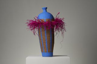 colourful vase with pink raffia frill