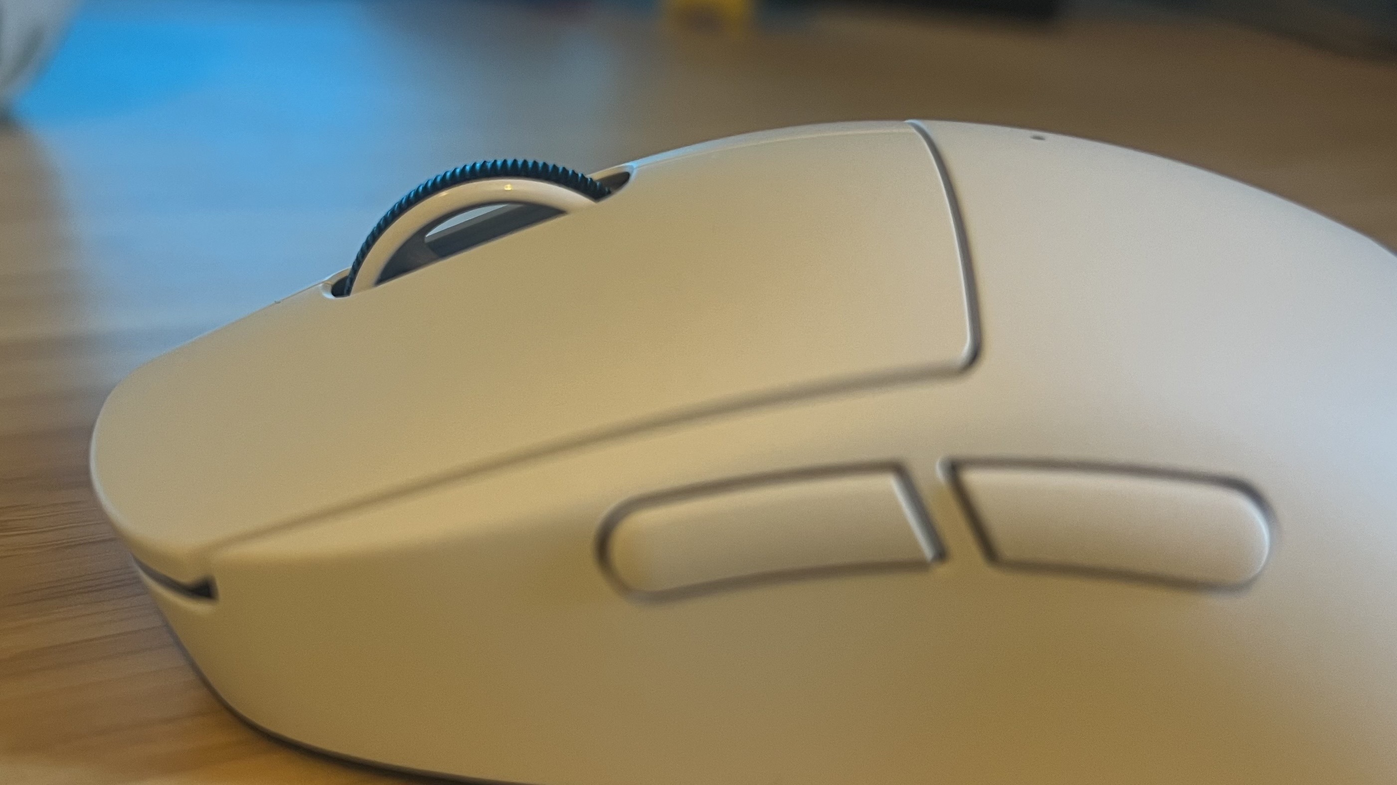Close up on side buttons and scroll wheel of Logitech G Pro X Superlight 2c gaming mouse