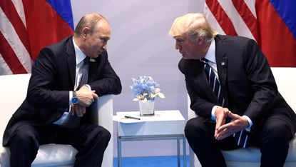 US President Donald Trump and Russia's President Vladimir Putin hold a meeting on the sidelines of the G20 Summit in Hamburg, Germany, on July 7, 2017. / AFP PHOTO / SAUL LOEB(Photo credit sh