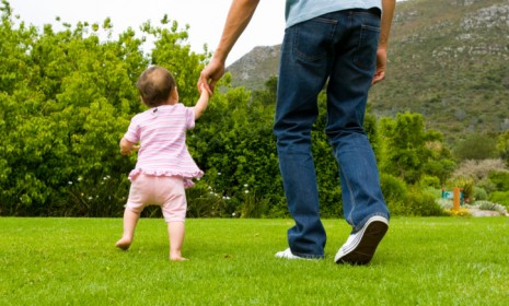 Usually, it's the dad who helps the baby walk