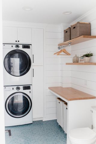 laundry room with white cabinets