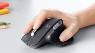 Logitech MX Master 3 mouse being used on a table, our top pick for best mouse