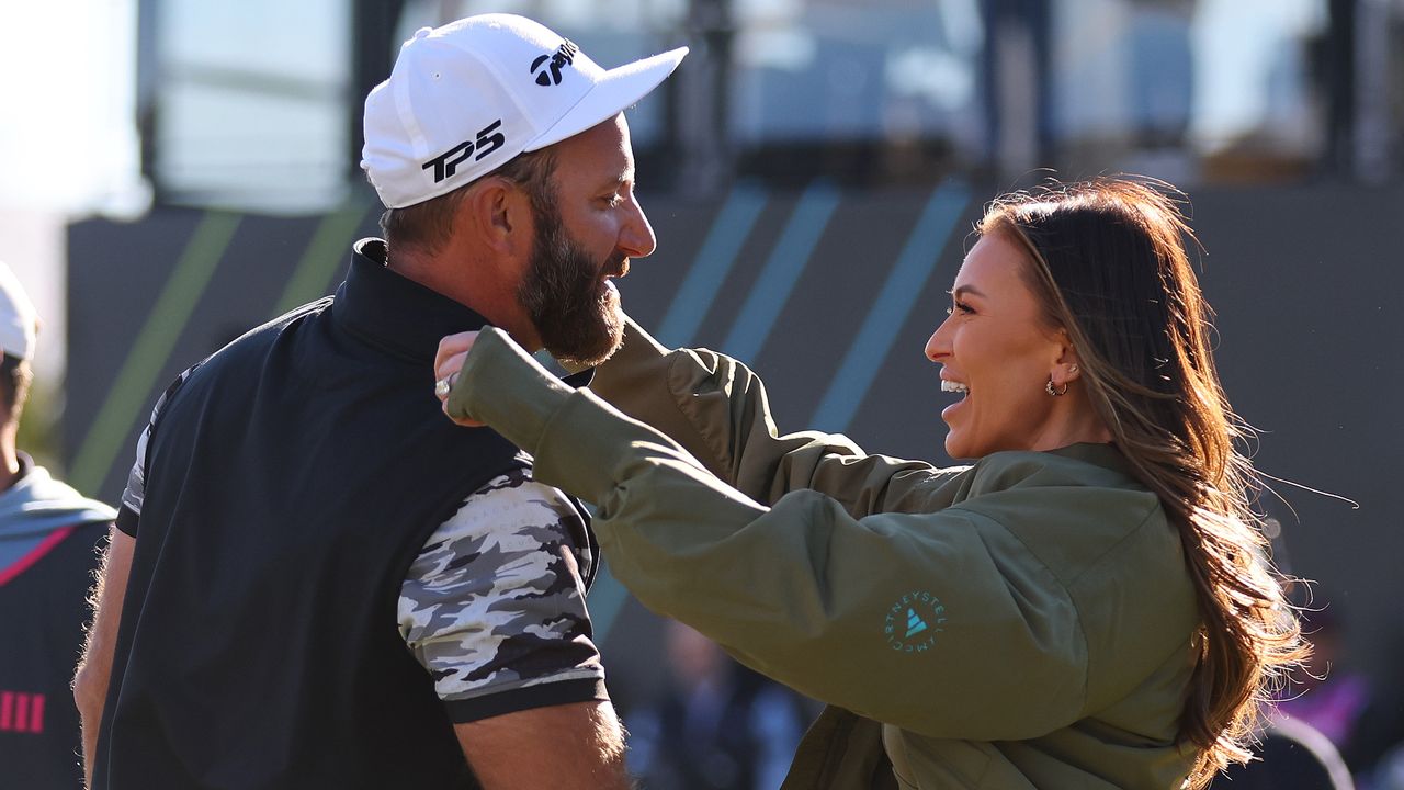 Paulina Gretzky hugs Dustin Johnson after a tournament win