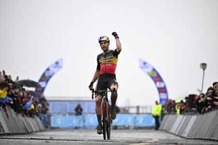 Belgian Wout Van Aert celebrates as he crosses the finish line to win the mens elite race at the Duinencross cyclocross cycling event on Thursday 05 January 2023 in Koksijde the fifth stage in the X2O Badkamers Trofee Veldrijden competitionBELGA PHOTO JASPER JACOBS Photo by JASPER JACOBS BELGA MAG Belga via AFP Photo by JASPER JACOBSBELGA MAGAFP via Getty Images