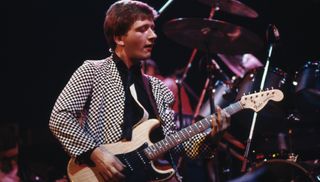 Glenn Tillbrook performs onstage with Squeeze at the Hammersmith Odeon in London in 1979