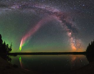 The majestic aurora-like phenomenon "Steve," now given the official acronym STEVE, shines with the Milky Way over Childs Lake, Manitoba in Canada.