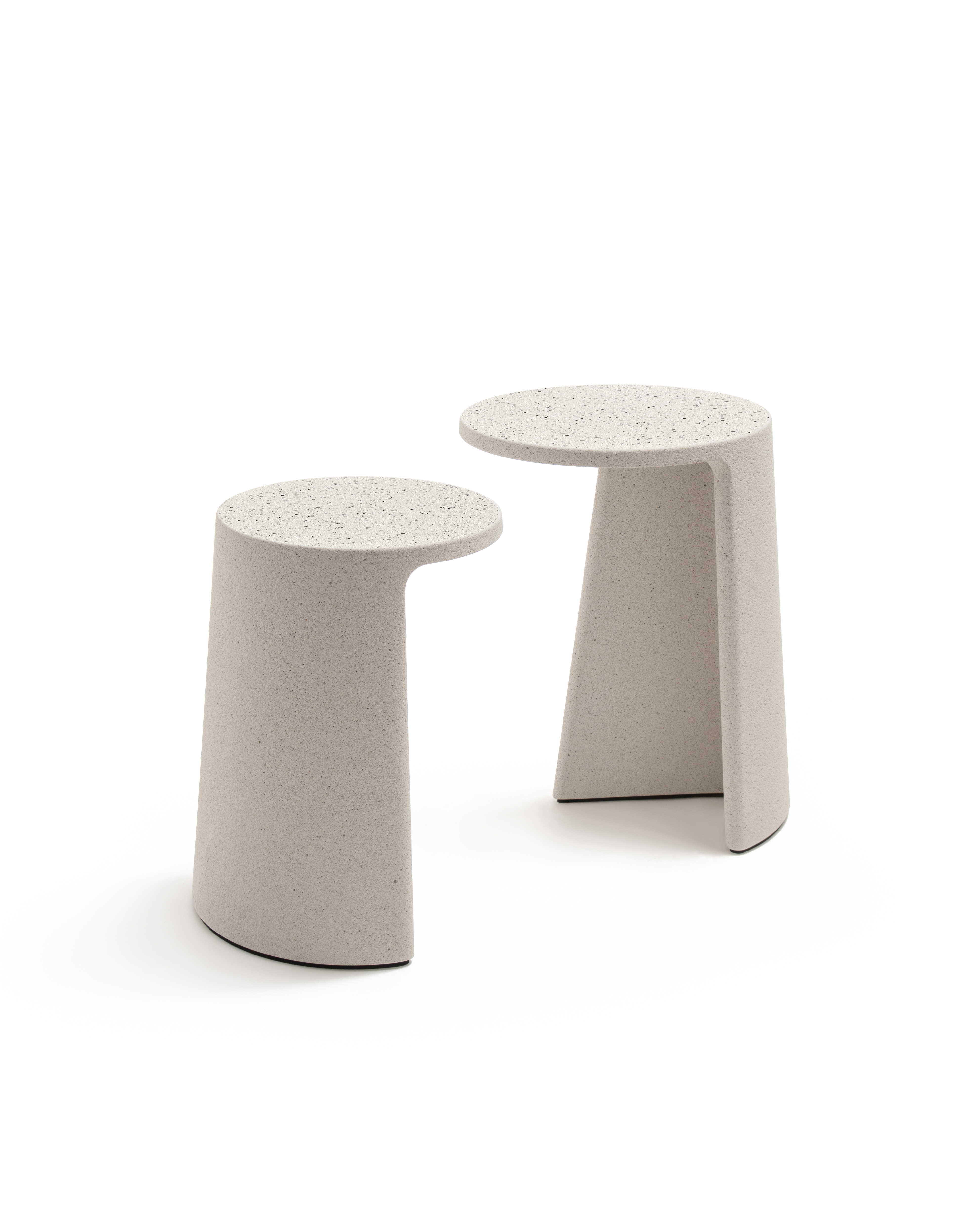 two small concrete side tables with circular tops on white background