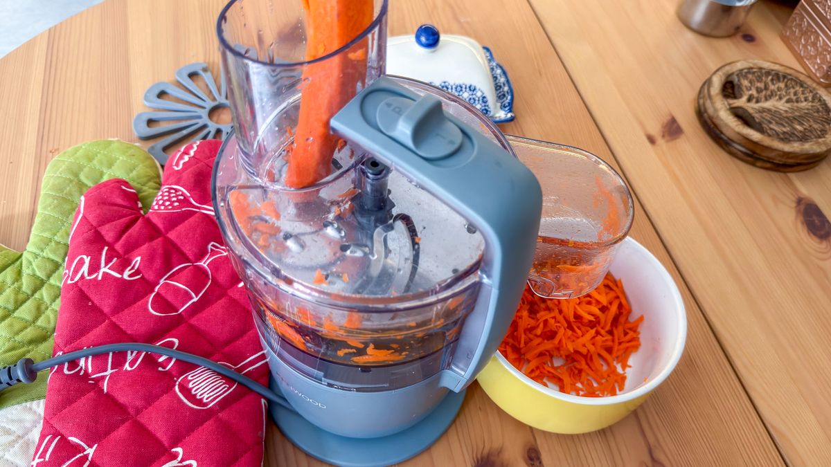 Carrot grated through the Express Serve attachment of the Kenwood MultiPro Go food processor into a bowl