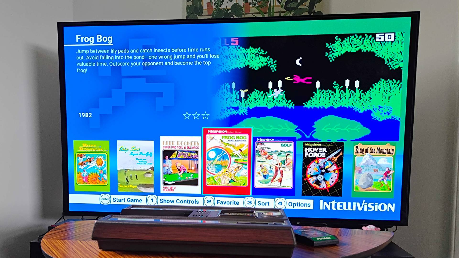 Intellivision Sprint connected to LG OLED C4 TV with main menu library displayed and "Frog Bog" selected.