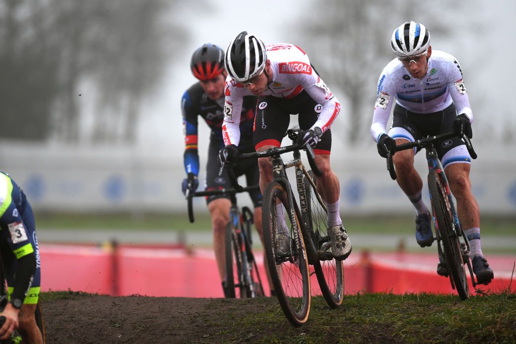RUCPHEN NETHERLANDS DECEMBER 18 LR Eli Iserbyt of Belgium and Team Pauwels Sauzen Bingoal and Lars Van Der Haar of The Netherlands and Team Baloise Trek Lions compete during the 9th Rucphen UCI CycloCross Worldcup 2021 Mens Elite CXWorldCup UCIcyclocrossWC on December 18 2021 in Rucphen Netherlands Photo by Luc ClaessenGetty Images