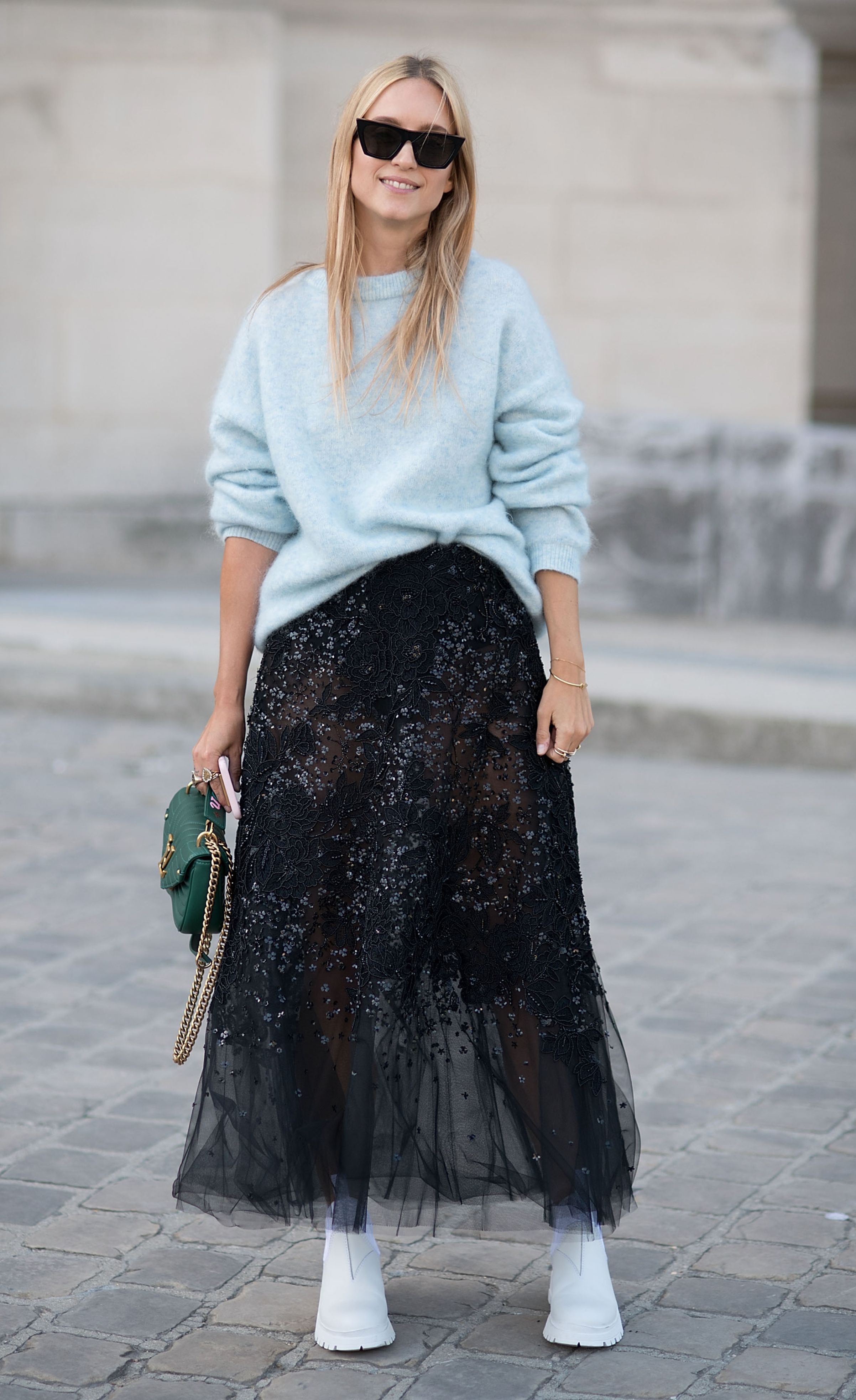 woman wearing long skirt outfit and trainers