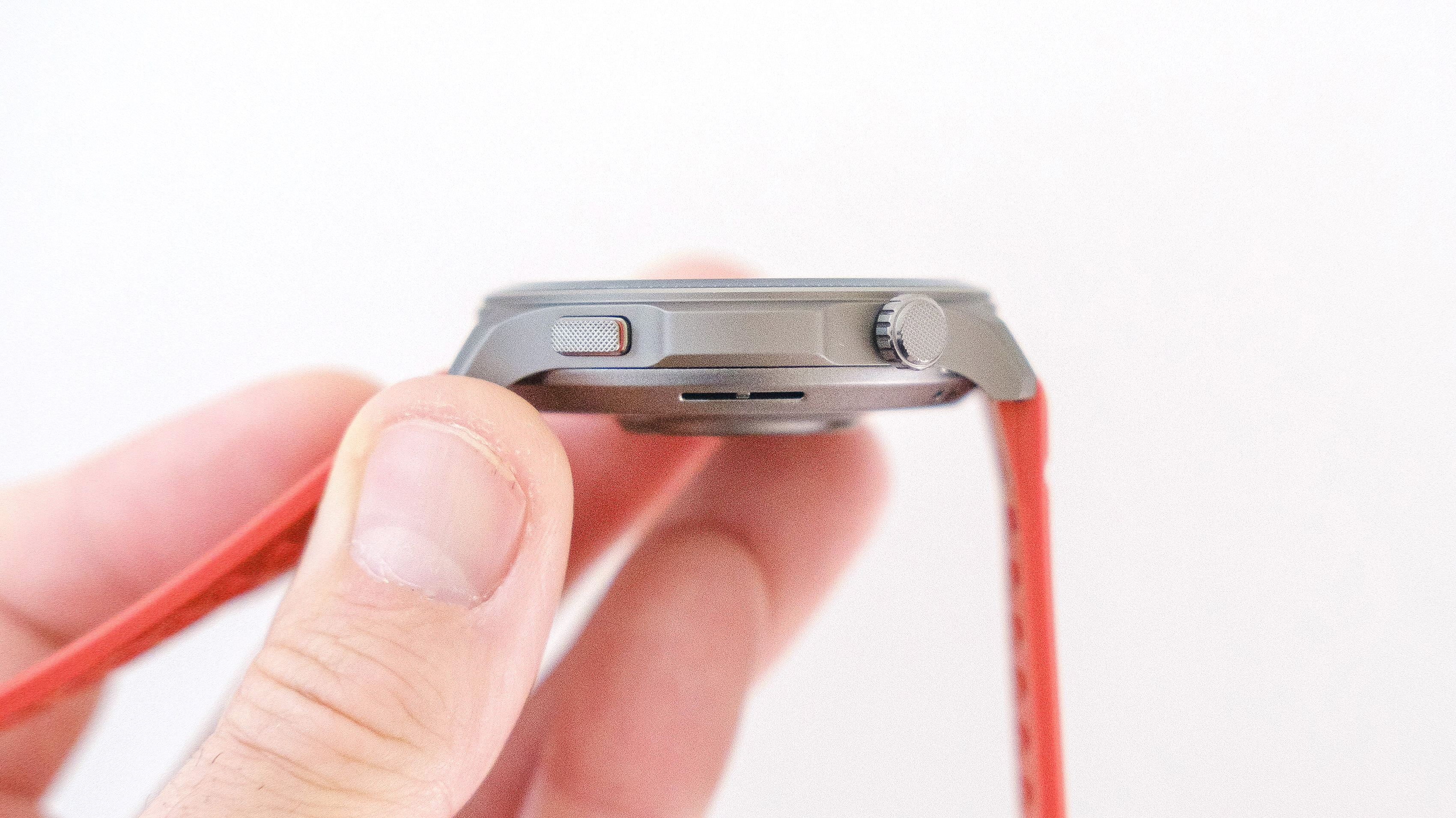 Close-up of the Amazfit Balance 2 smartwatch on an orange rubber strap
