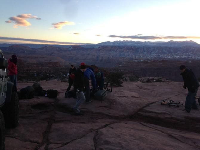 The sun comes up over the La Sals while the crew gets ready