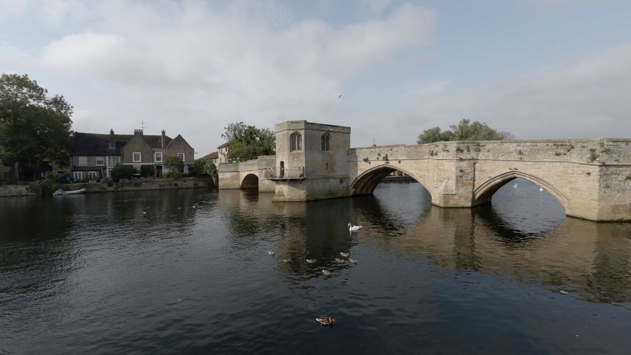 A large stone bridge crossing a river shot on a Kandao QooCam 3 Ultra 360 camera