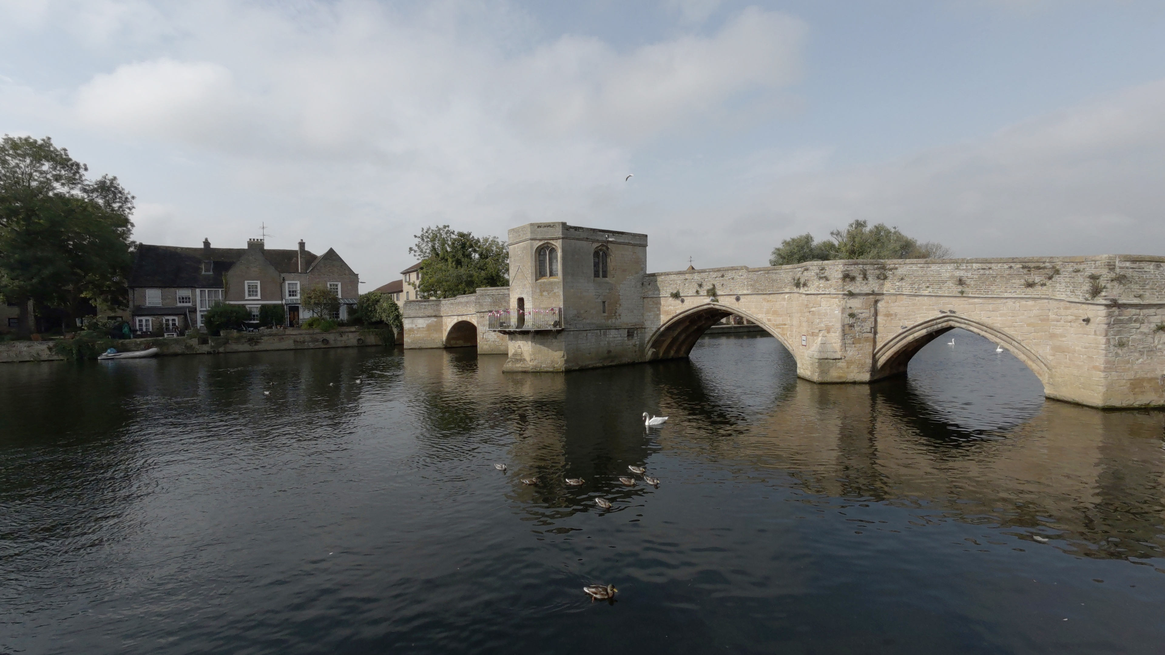 A large stone bridge crossing a river shot on a Kandao QooCam 3 Ultra 360 camera