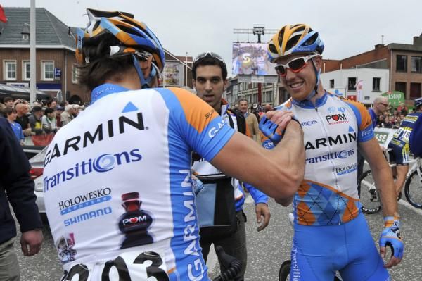 Race winner Tyler Farrar, right, celebrates his victory with teammate Steven Cozza.