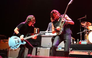 Rick Springfield (right) performing onstage with Dave Grohl