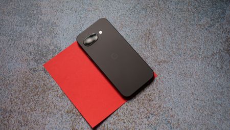 Google Pixel 9a back on a red background