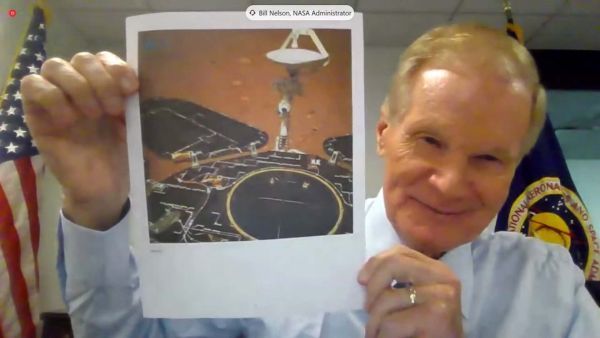 NASA Administrator Bill Nelson holds up a photo of China&#039;s Zhurong Mars rover during a House hearing on May 19, 2021.