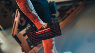 Person holding the PowerBlock Sport 2.4 Adjustable Dumbbell in their hand