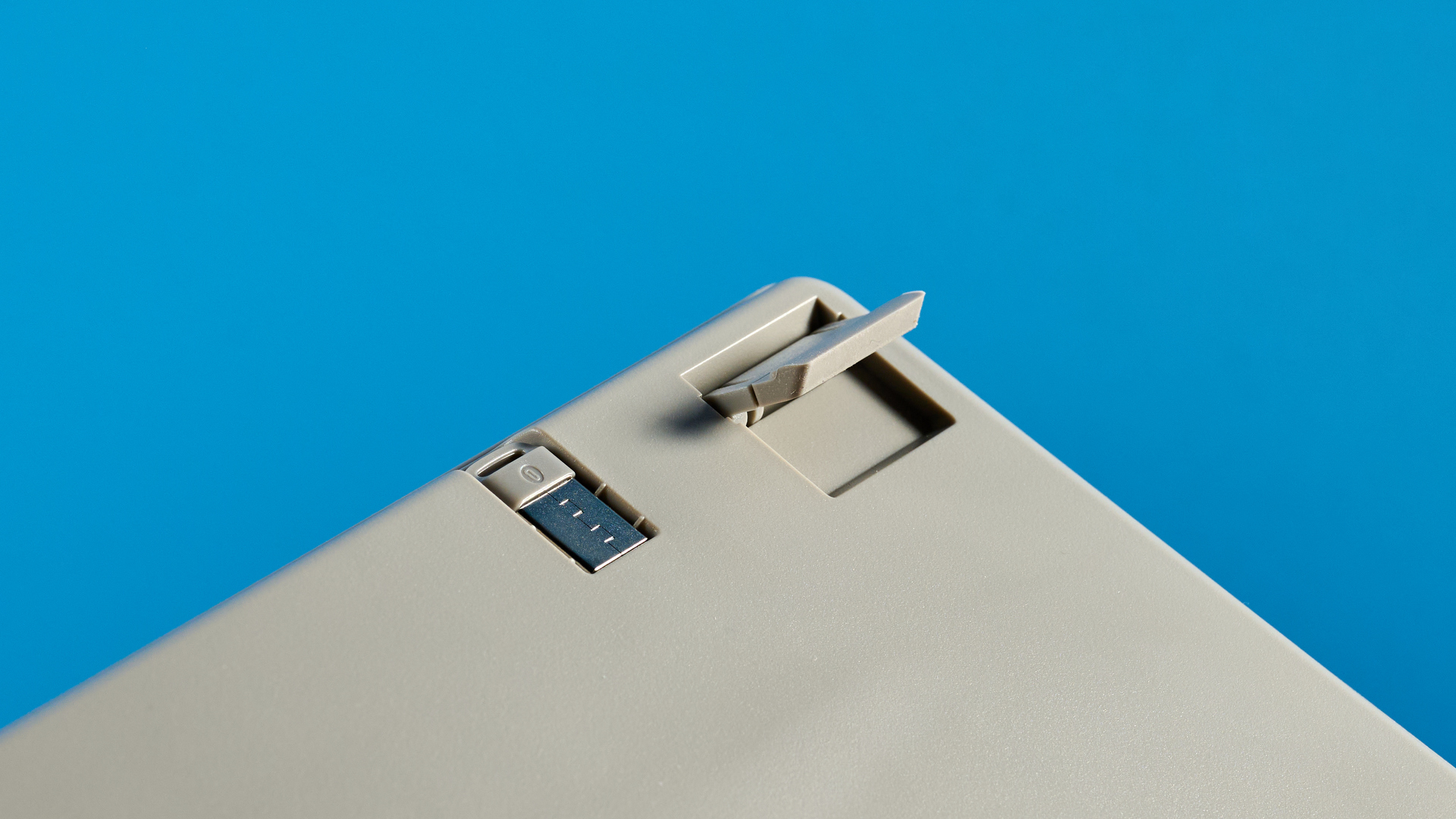 The Lofree Flow Lite84 foot against a blue background
