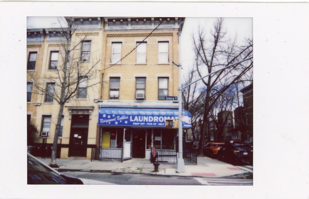 A photography of a laundromat taken on the Fujifilm Instax mini 99 with the neutral filter.