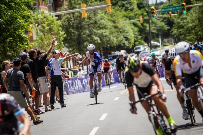 Riders took water bottles during todays long hot race.