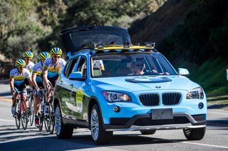 SmartStop Director Mike Creed motorpaces his team during a recent training camp in California.