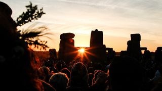 Crowds celebrating summer solstice and the dawn of the longest day of the year at Stonehenge on June 21, 2018 in Wiltshire, England.
