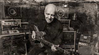 Peter Frampton with guitar (studio portrait)
