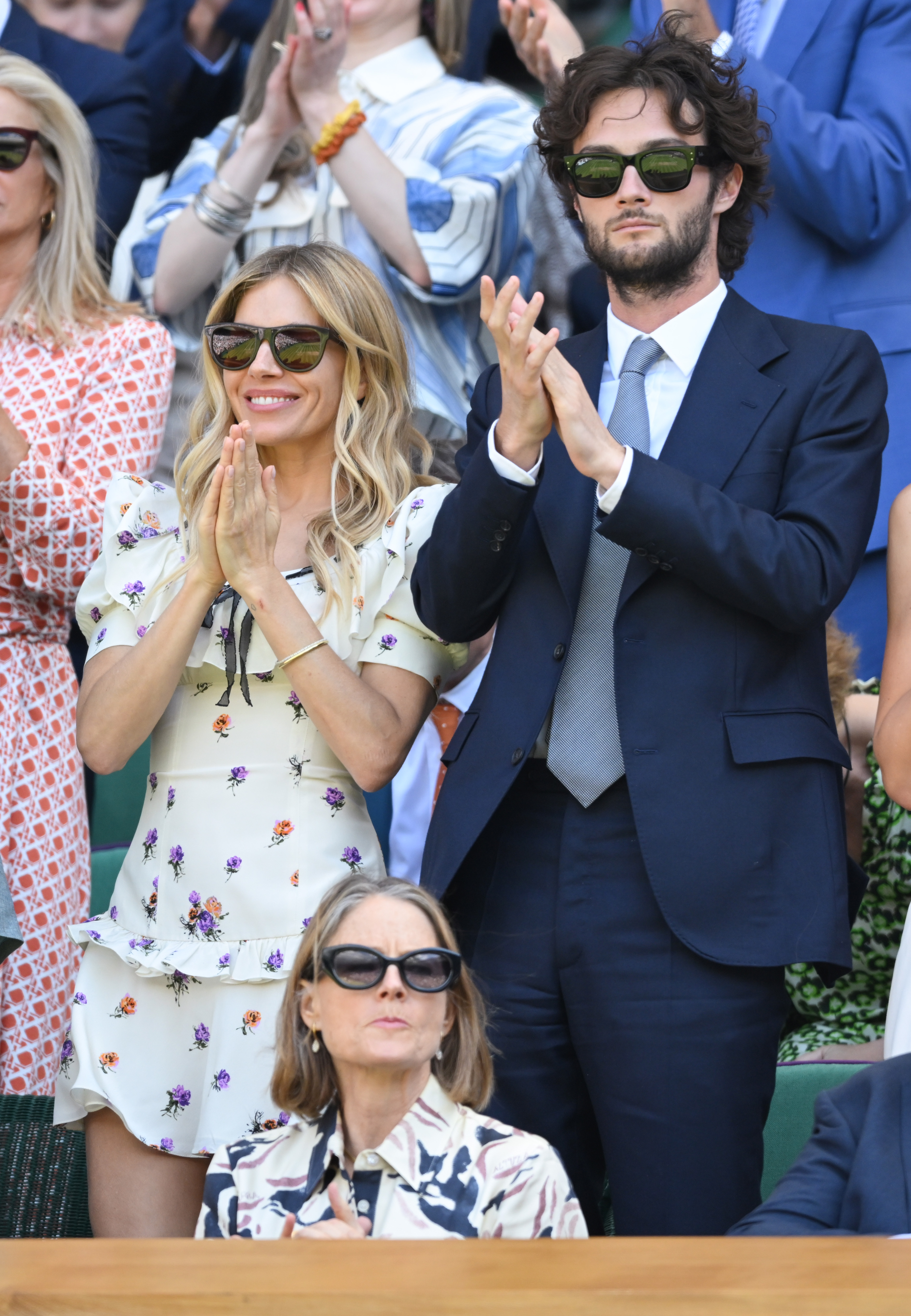 Sienna Miller wears a cap sleeve Alessandra Rich dress at Wimbledon