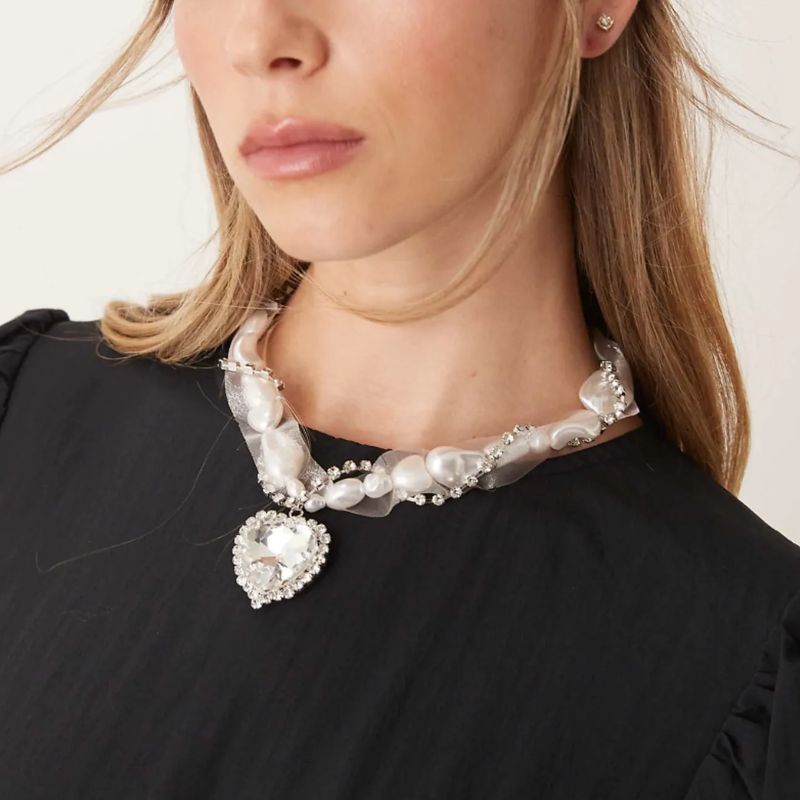 Necklace With Mixed Faux Pearl Organza and Heart Crystal Detail on model 