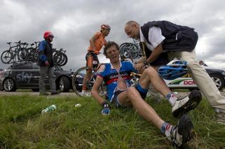 Johan Vansummeren (Garmin-Sharp) is assisted after crashing on stage 6.