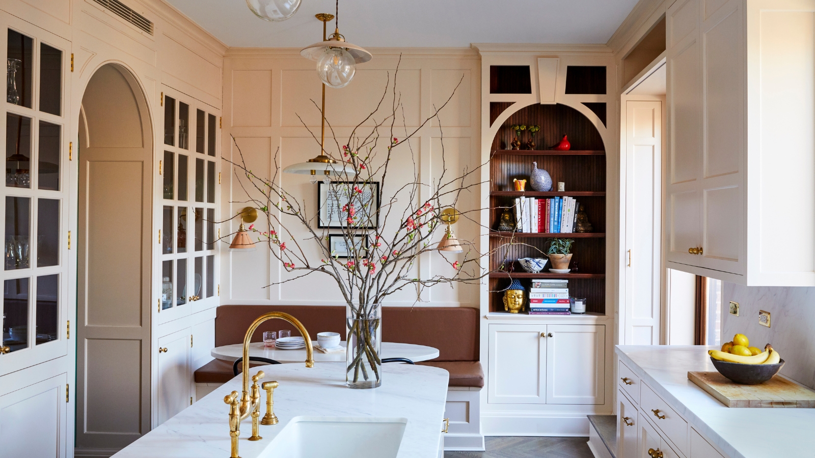 A warm neutral kitchen with curved details