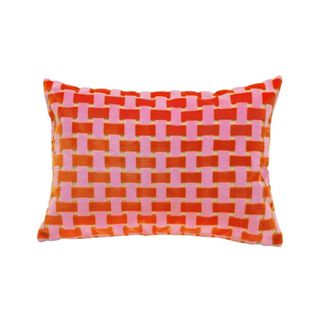 A checked pillow in red and pink