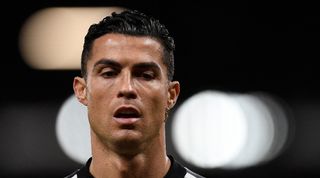 Cristiano Ronaldo warms up ahead of Manchester United's game againstr Tottenham at Old Trafford.