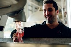 Gusbourne_Charlie_tasting_harvest_juice.jpg