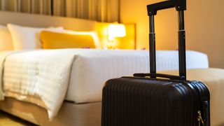 Suitcase in a hotel room