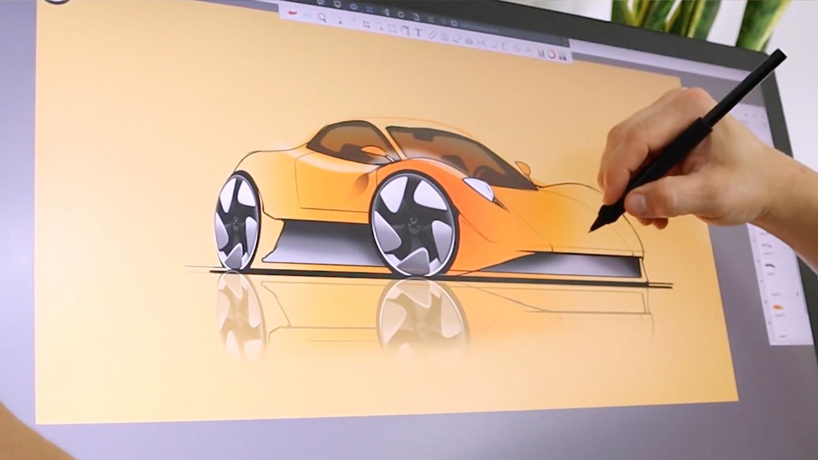 Wacom Bridge; a person draws a car on a pen display