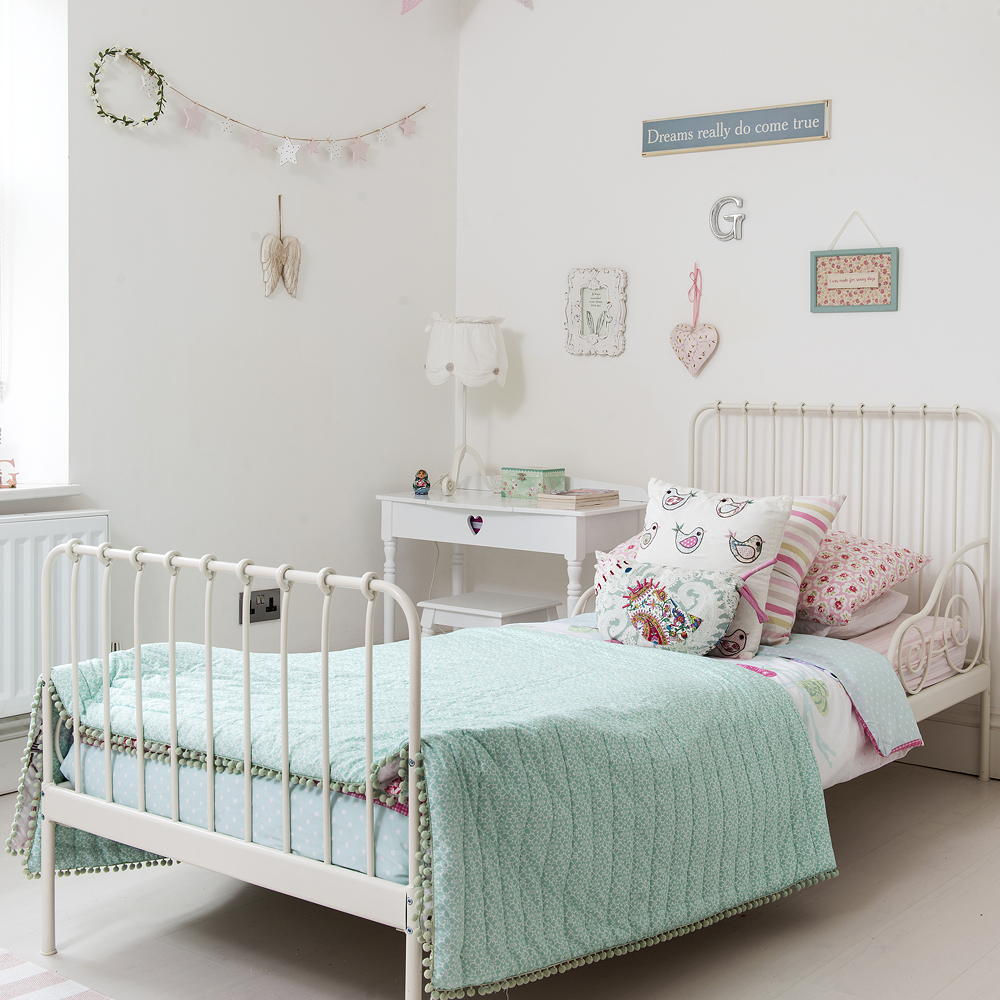 chindrens room with white wall bed and white flooring