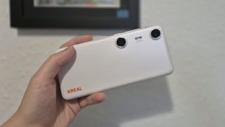 The Xreal Beam Pro in front of a wall