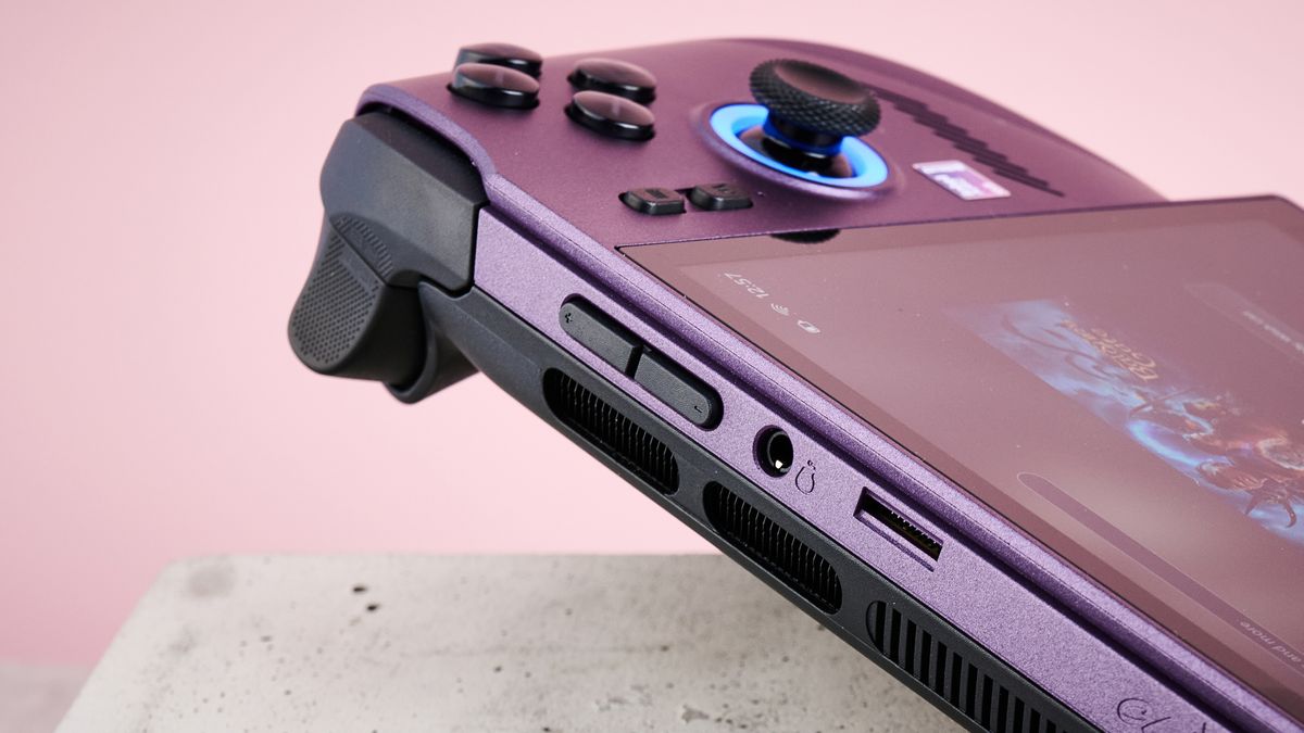 A closeup of the top right corner of MSI Claw 8 EX AI+, showing its right trigger, right shoulder button, volume buttons, headphone jack and microSD card slot.