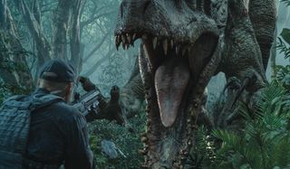 Jurassic World an ACU member in front of the Indominous Rex's open mouth