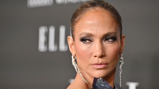 Jennifer Lopez on Elle red carpet in breastplate look.