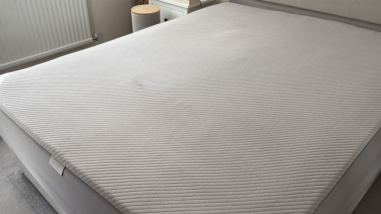 The Orion Sleep System on a mattress in our reviewer's bedroom. IN the background the Control Tower is visible