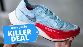 A photo of a runner holding the Nike Vaporfly Next% 2 
