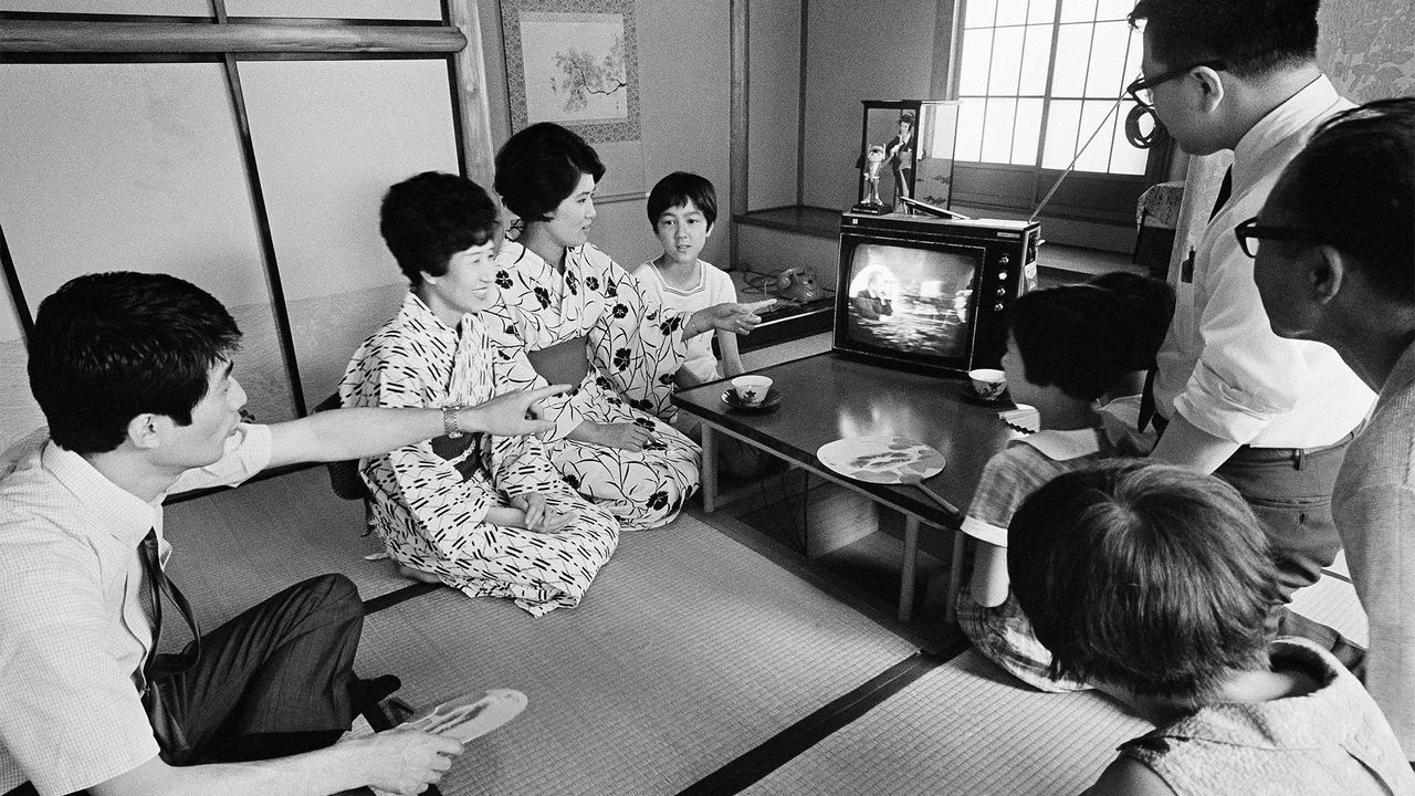 An unidentified Japanese family watched U.S. President Richard Nixon speak as astronauts walked on the moon.