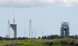 After a brief stay on the launch pad, the OFT-2 Starliner capsule and its Atlas V rocket were rolled back to shelter from harsh weather on July 30, 2021, after a delay pushed the flight to no earlier than Aug. 3, 2021.